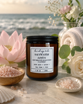 Saltwater Lotus candle with pink flowers and sea salt on a beach setting