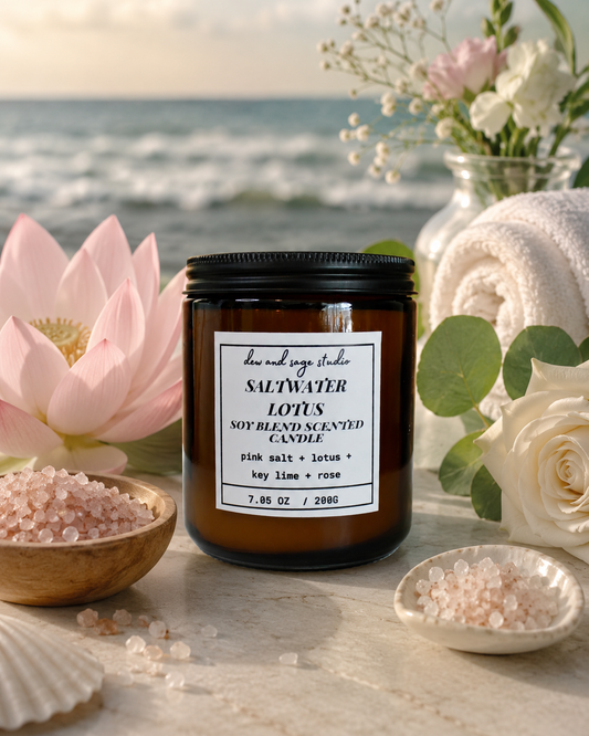 Saltwater Lotus candle with pink flowers and sea salt on a beach setting