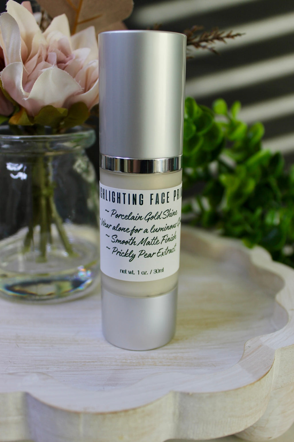 Skincare product with label on a wooden surface with flowers in the background