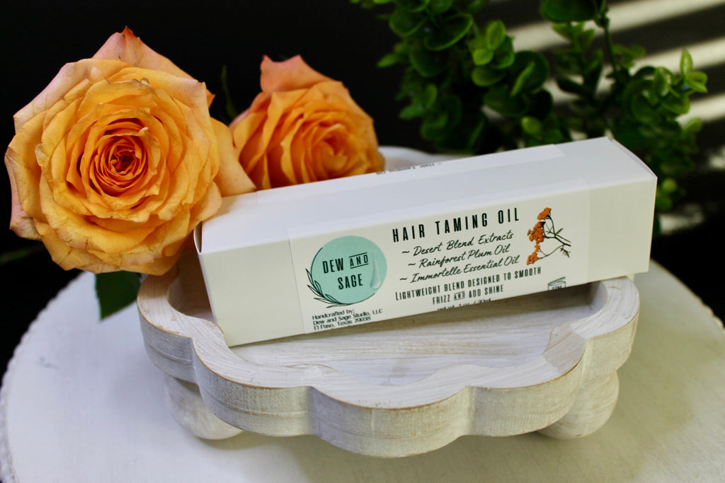 Bar of soap on a wooden stand with orange roses and greenery in the background