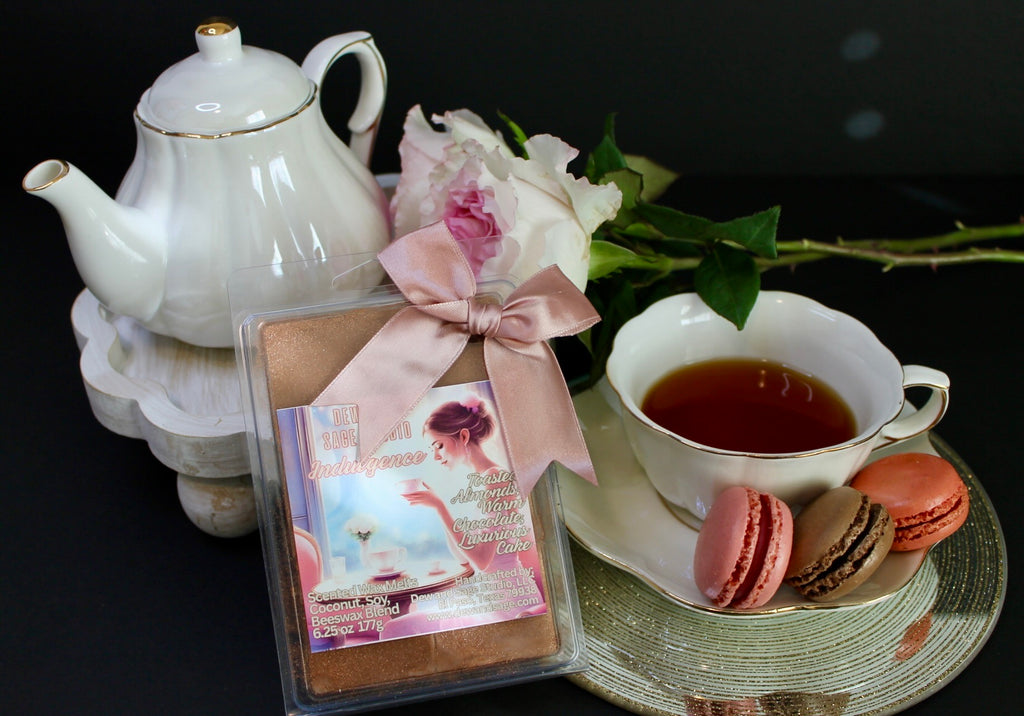 Tea set with teapot, cup, cookies, and wax melts on a dark background