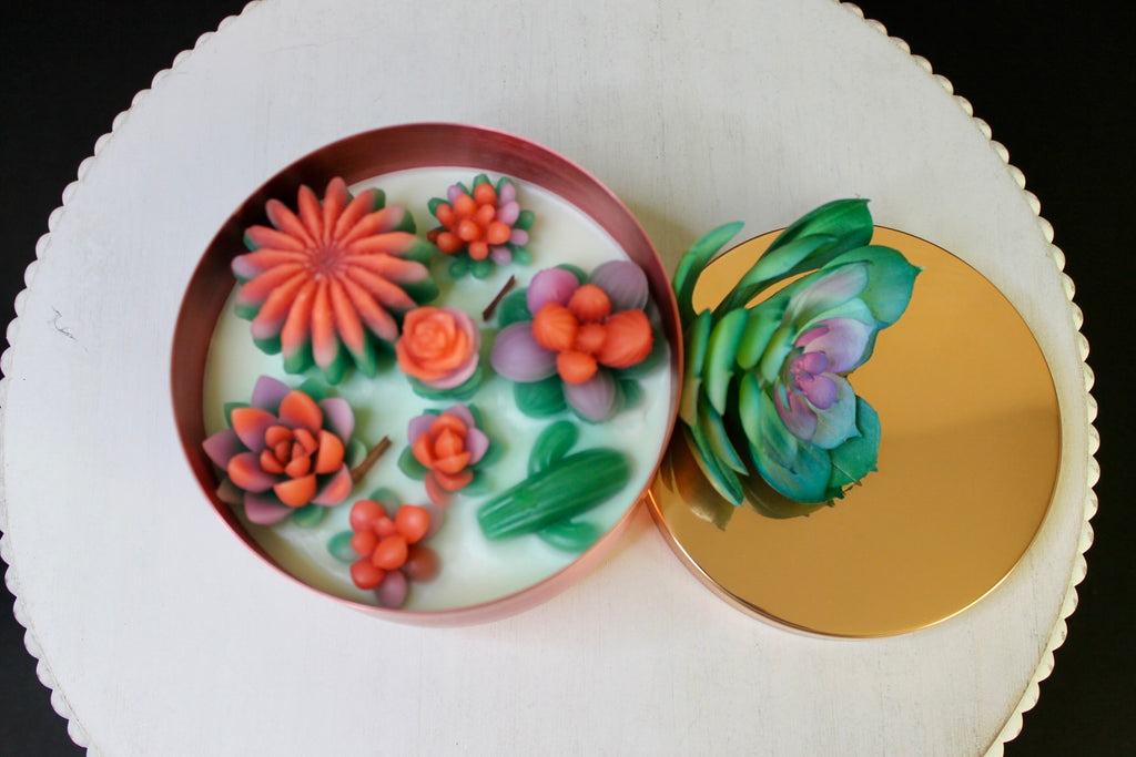 Decorative round plates with floral designs on a white surface