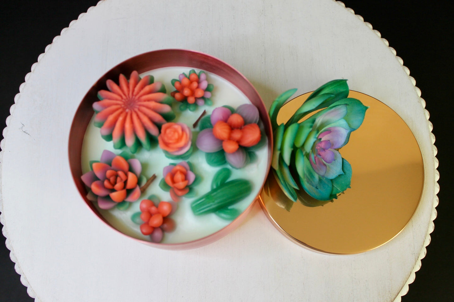 Decorative round plates with floral designs on a white surface